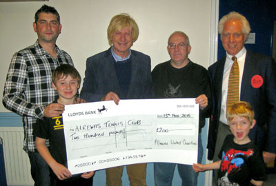 Michael and Dr Robert Horton awarding a cheque to members of the Alrewas Tennis Club